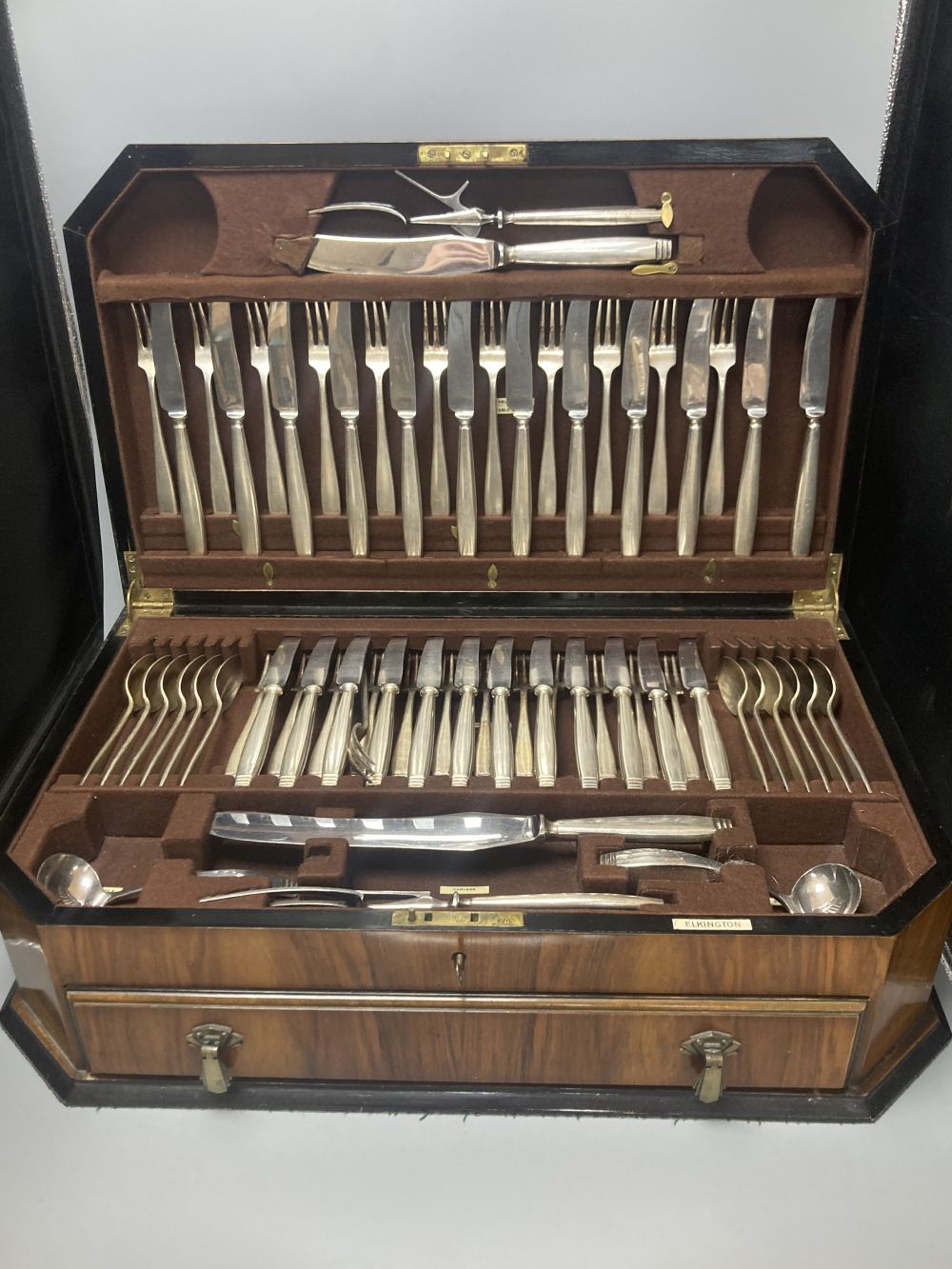 A cased Elkington plated canteen of Rochester-pattern cutlery, near complete, and similar oak cased set of twelve fish knives and forks